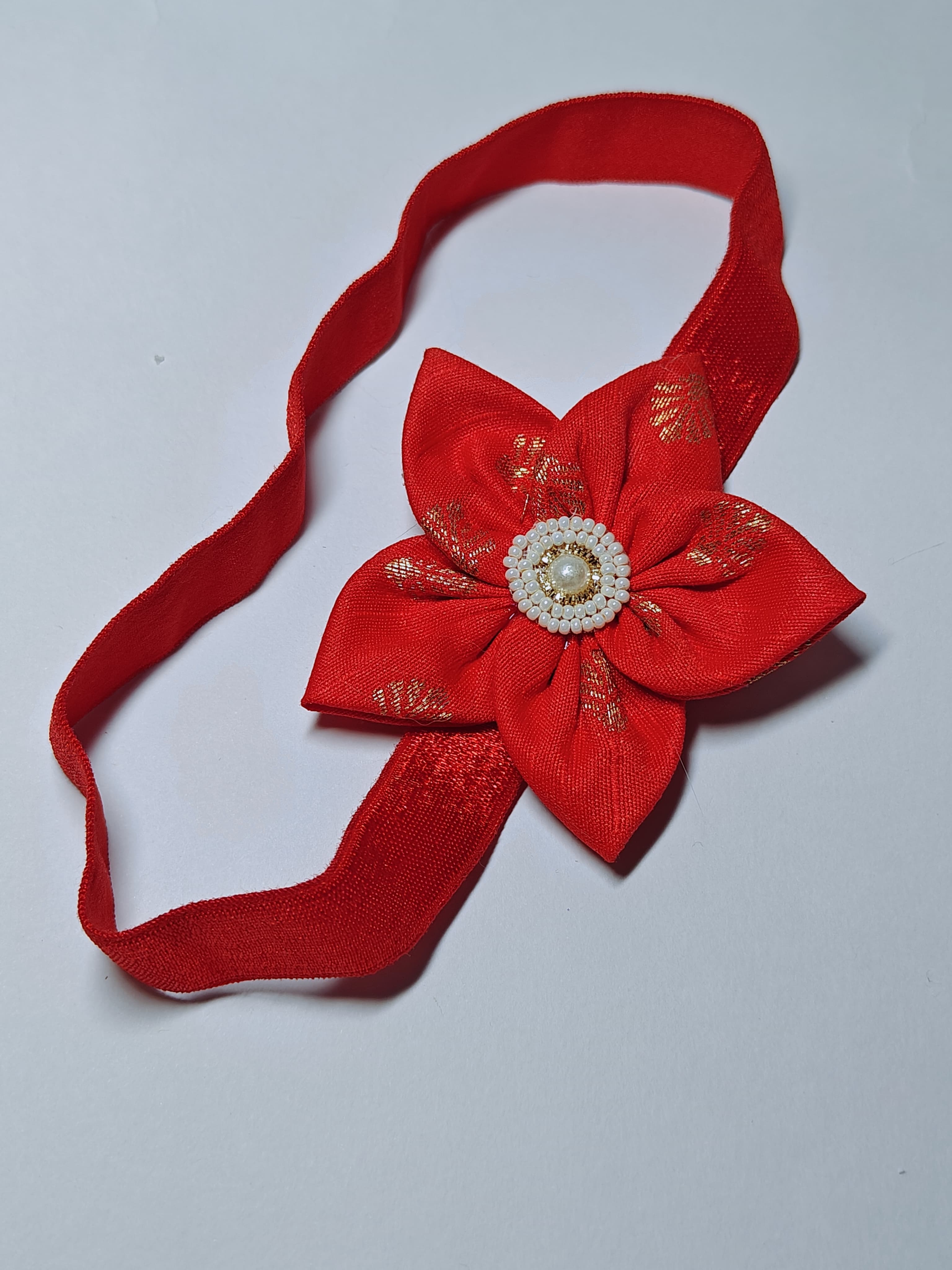 Bright Coloured Sadafuli Flower Stretchable headband for baby girl.Adorn your princess with head to toe premium quality handcrafted accessories made from allergy free, best quality materials.