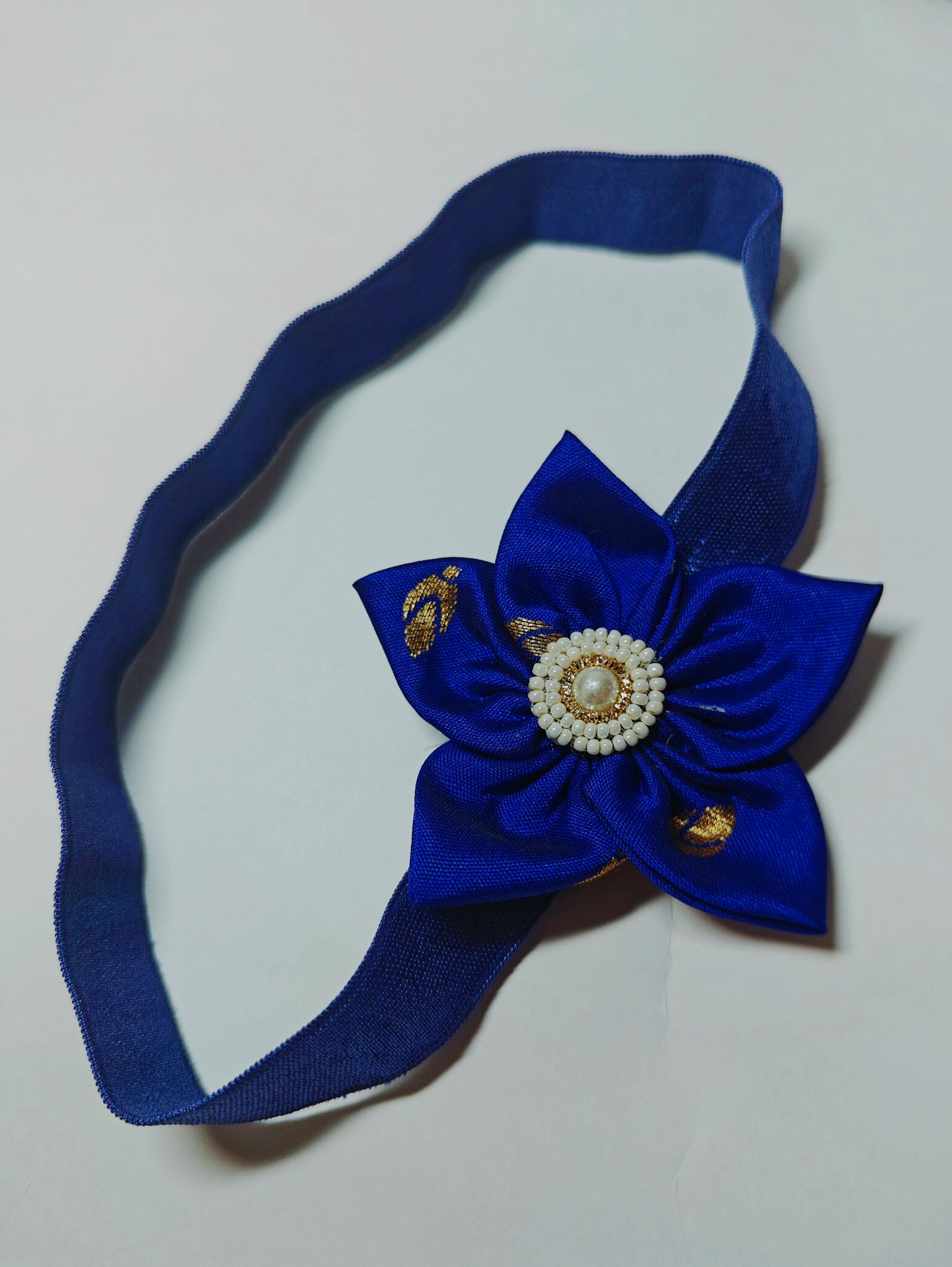 Cool Coloured Sadafuli Flower Stretchable headband for baby girl.Adorn your princess with head to toe premium quality handcrafted accessories made from allergy free, best quality materials.