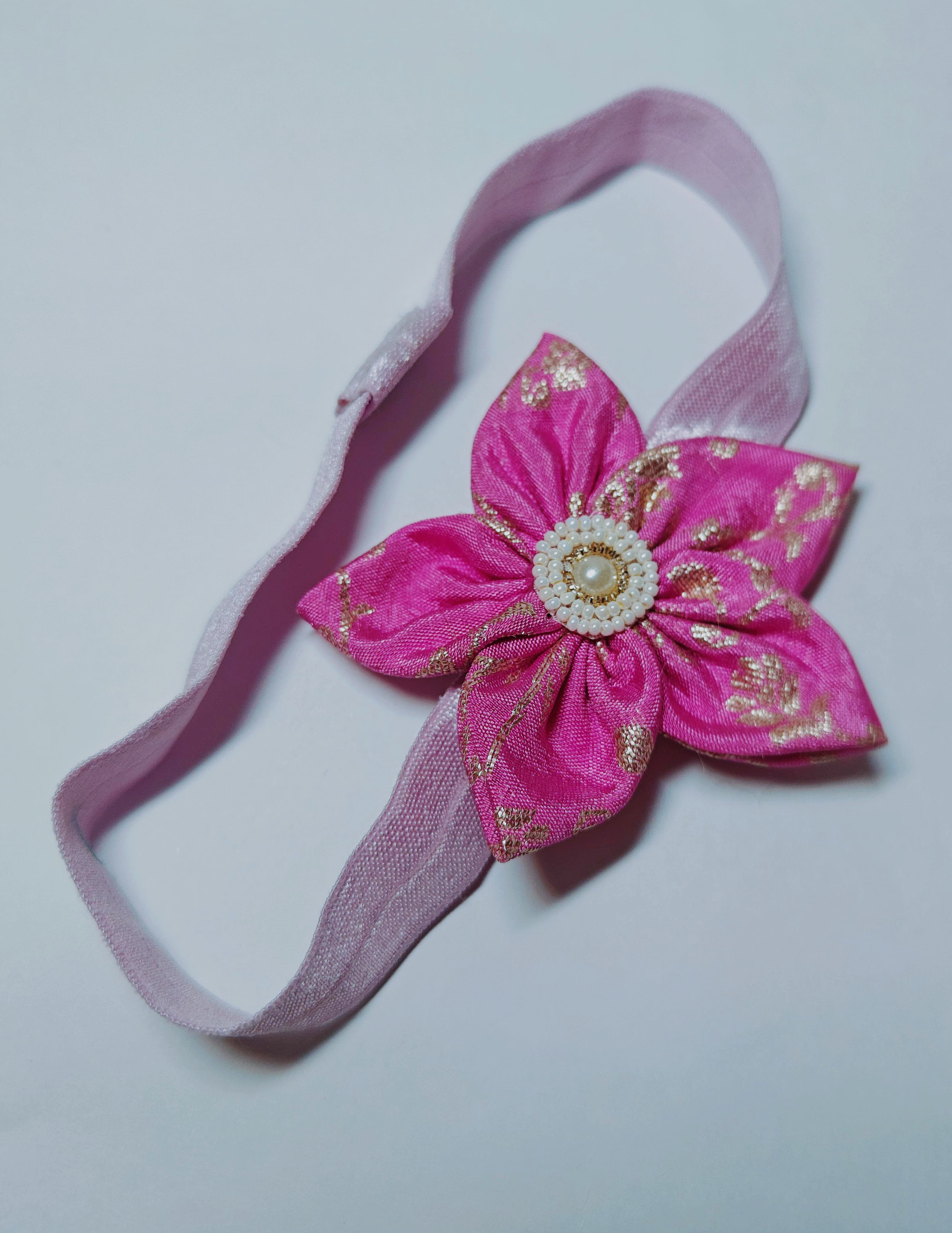 Cool Coloured Sadafuli Flower Stretchable headband for baby girl.Adorn your princess with head to toe premium quality handcrafted accessories made from allergy free, best quality materials.