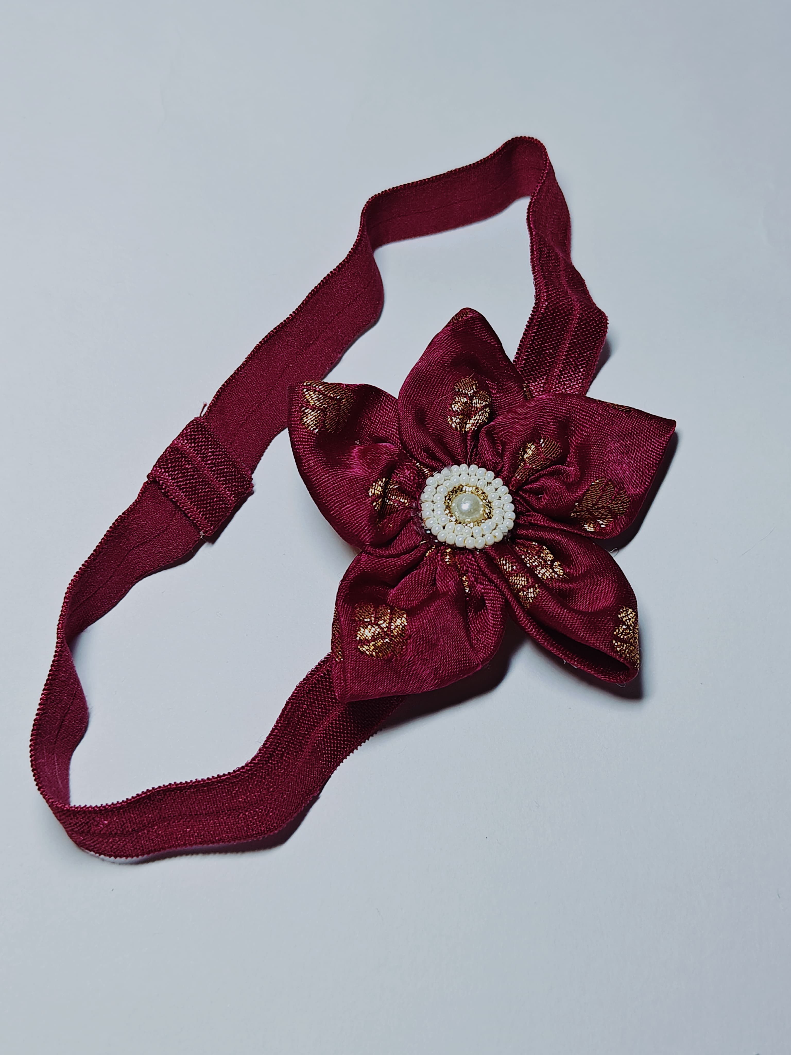 Bright Coloured Sadafuli Flower Stretchable headband for baby girl.Adorn your princess with head to toe premium quality handcrafted accessories made from allergy free, best quality materials.