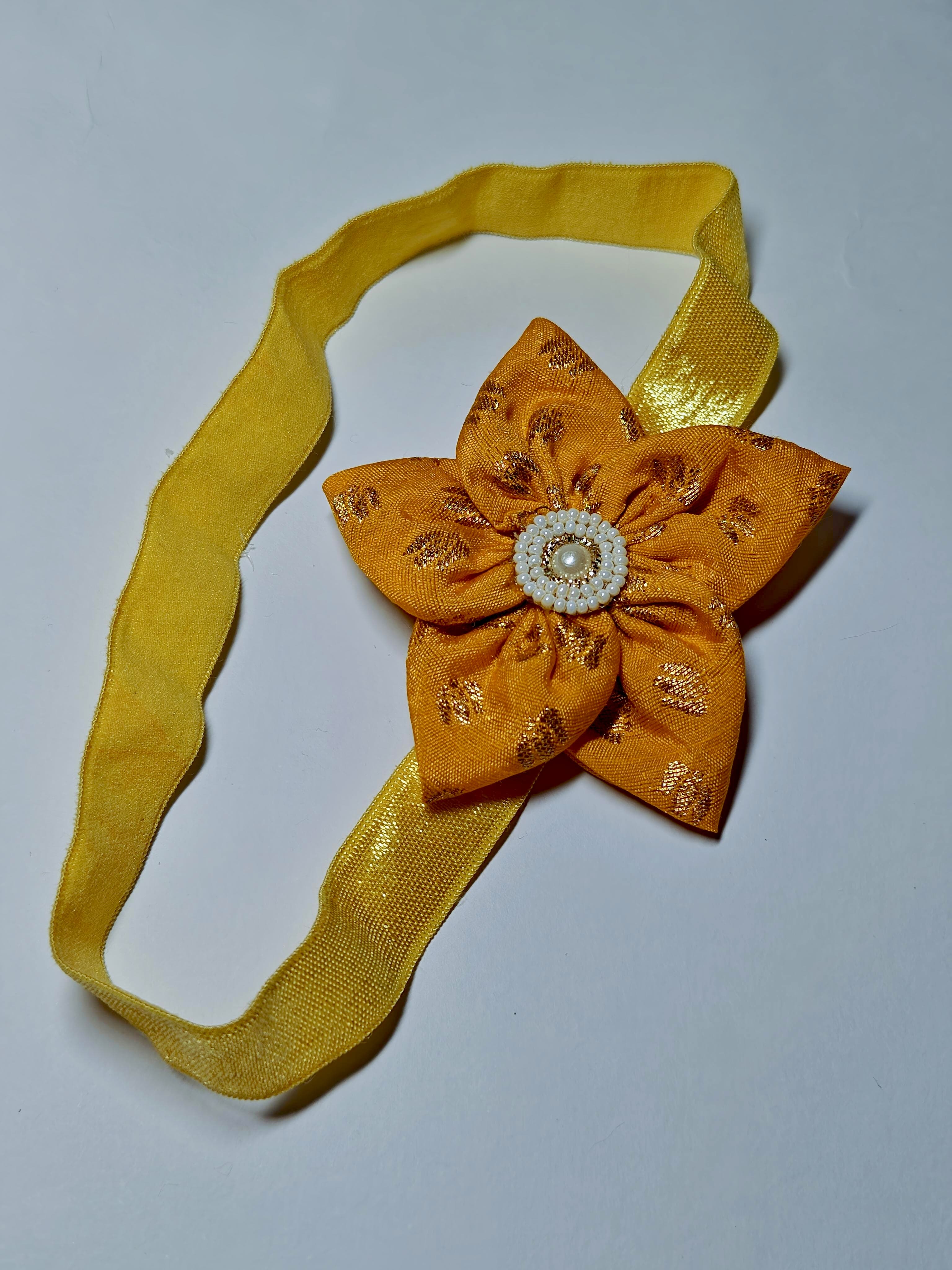 Bright Coloured Sadafuli Flower Stretchable headband for baby girl.Adorn your princess with head to toe premium quality handcrafted accessories made from allergy free, best quality materials.