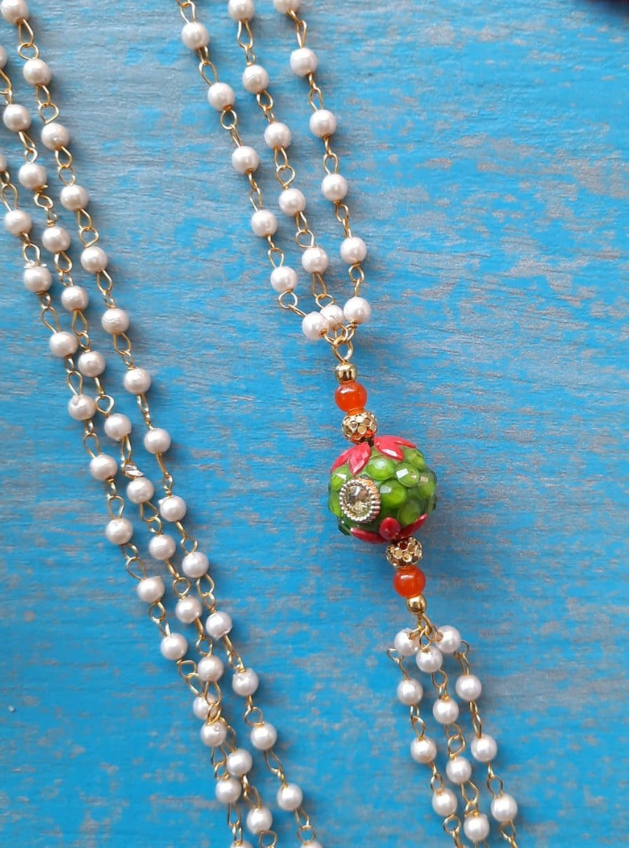 Orange Round Pachi bead with Pearl Triple Layer Kanthi for Batu. It is worn by Batu for Vratabandh/Munj/Upnayan/ Thread Ceremony.Mundavalya,kanthi,bhikbali,topi,pagdi are boys accessories exclusively designed using Pearls,glass beads,jadau & gold plated findings for Batu,for Upanayan/Vratabandha/munj /thread ceremony.