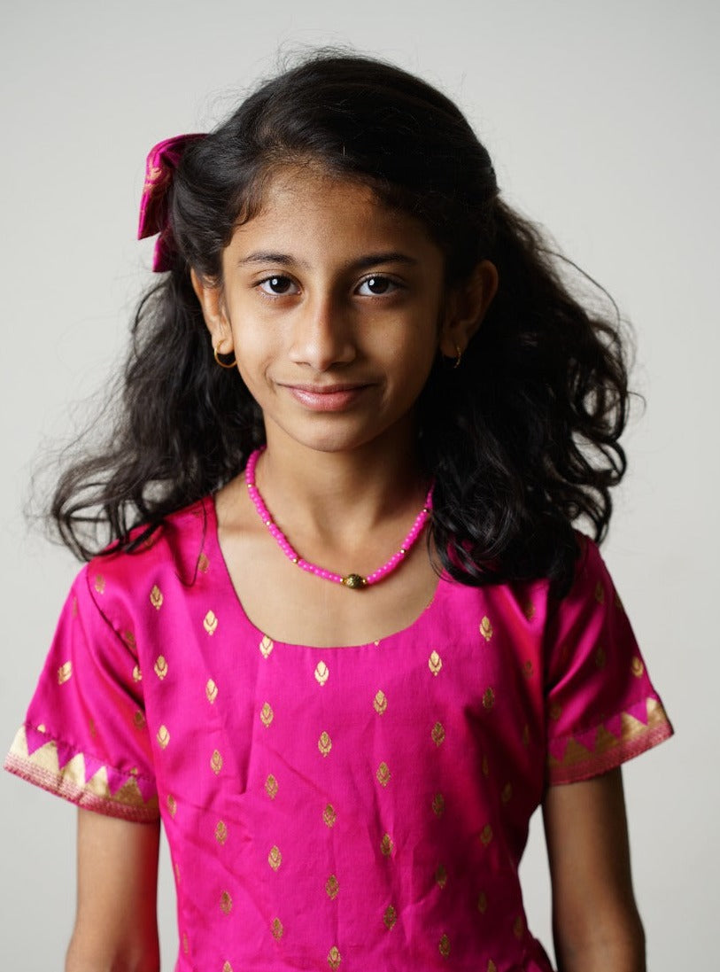 Fuchsia pink brocade taffeta silk frock with intricate Paithani border for girls.Let your princess be as comfortable as in her casuals with carefully designed & crafted Comfort Ethnic Wear by Soyara Ethnics.Keep her fashion quotient high with timeless patterns, vibrant combinations and royal textiles.