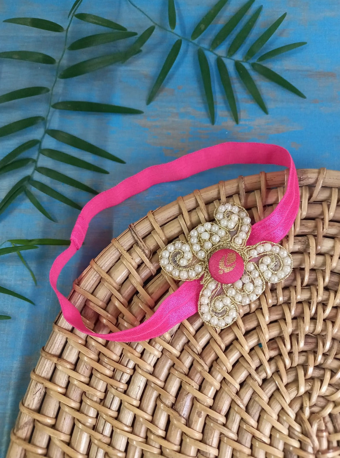 Pearl embellished stretchable Candy Pink headband for a baby