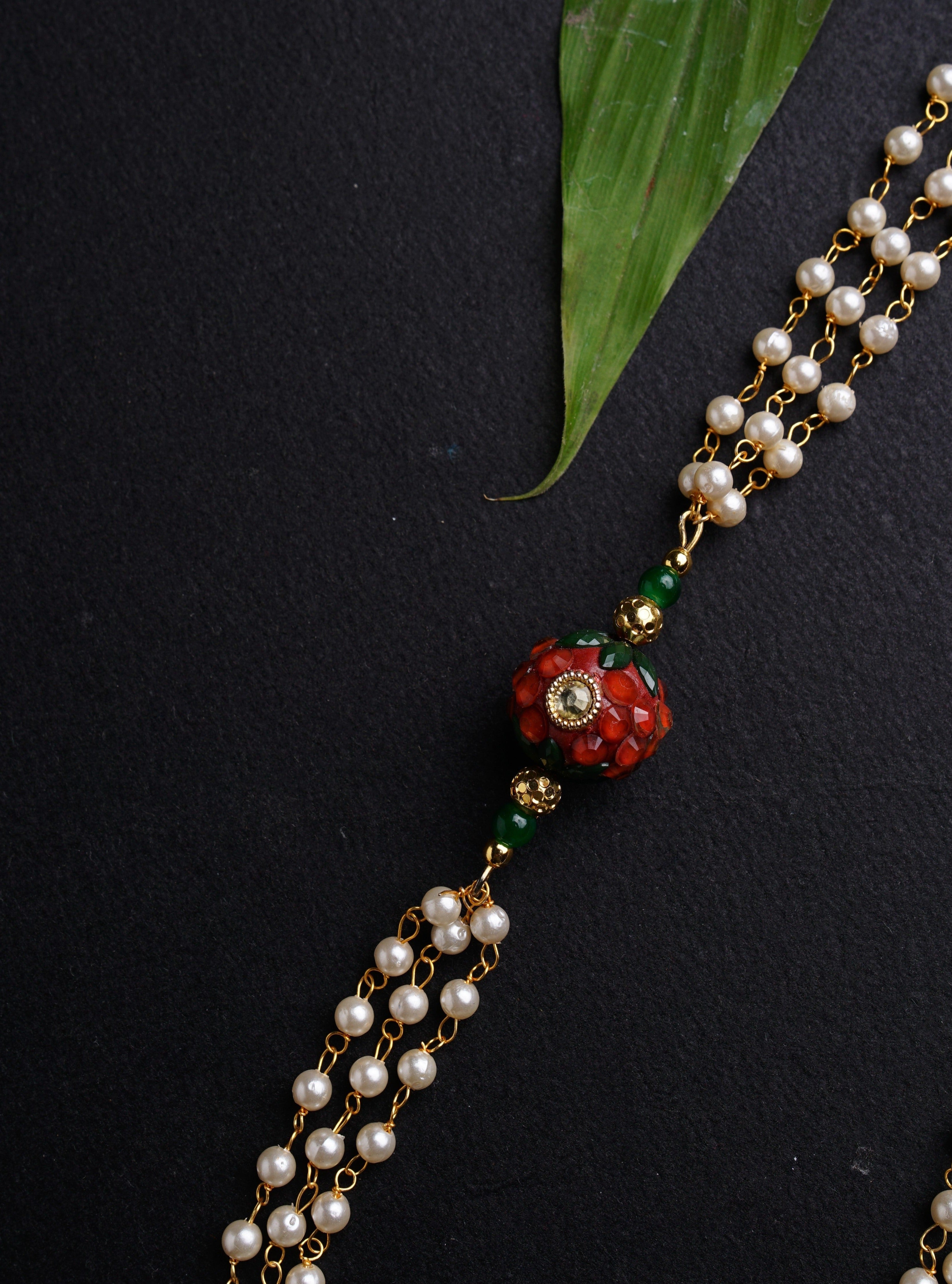 Dark Green Round Pachi bead with Pearl Triple Layer Kanthi for Batu. It is worn by Batu for Vratabandh/Munj/Upnayan/ Thread Ceremony. Mundavalya,kanthi,bhikbali,topi,pagdi are boys accessories exclusively designed using Pearls,glass beads,jadau & gold plated findings for Batu,for Upanayan/Vratabandha/munj /thread ceremony.