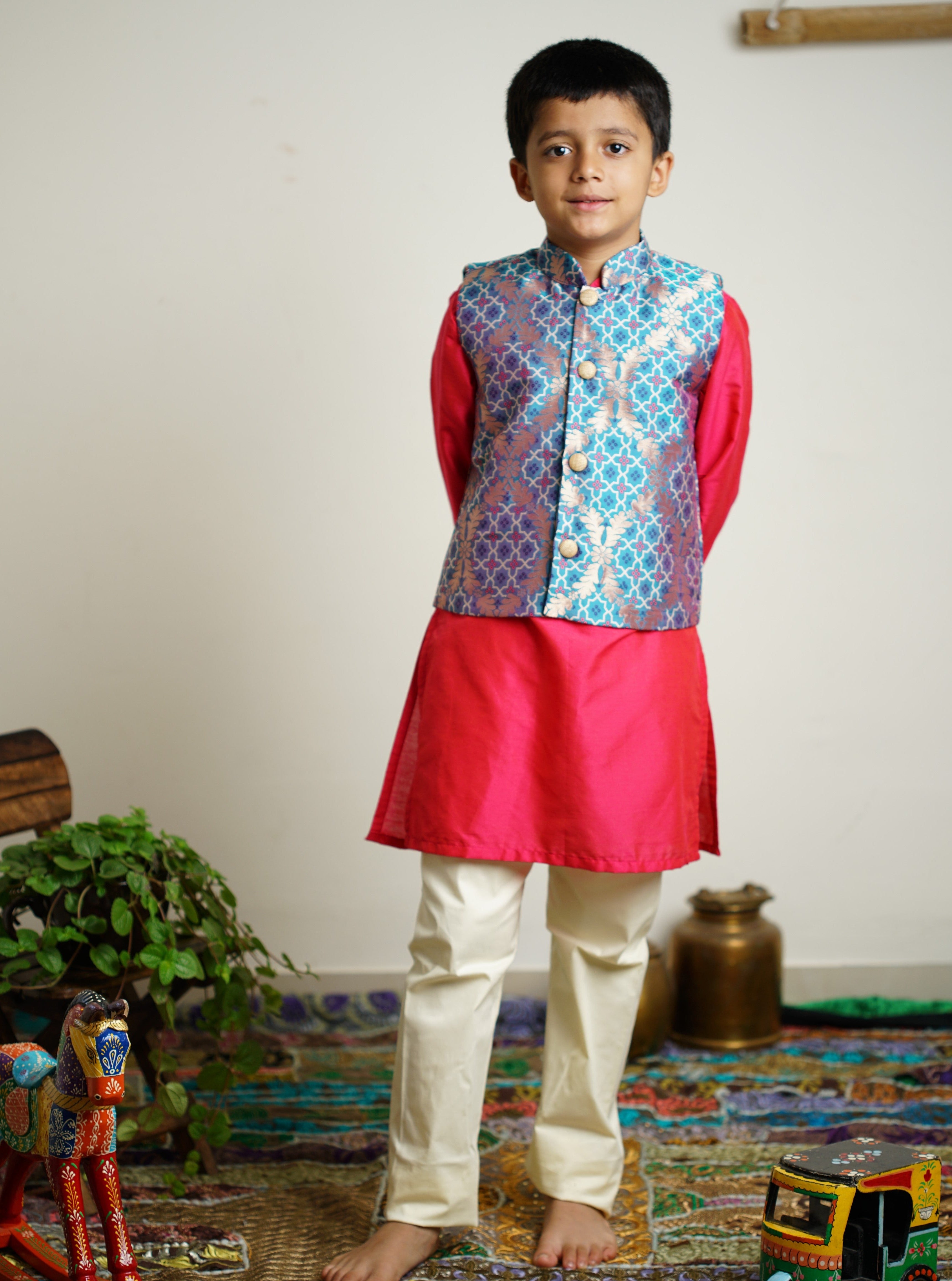 Aqua blue Brocade jacket with multicolored bandhani design .Cotton lining from inside avoid sweating but give warmth.Statement embellished buttons add royal charm to these jackets. Team these with any plain colored kurta or satin shirt for best festive look!