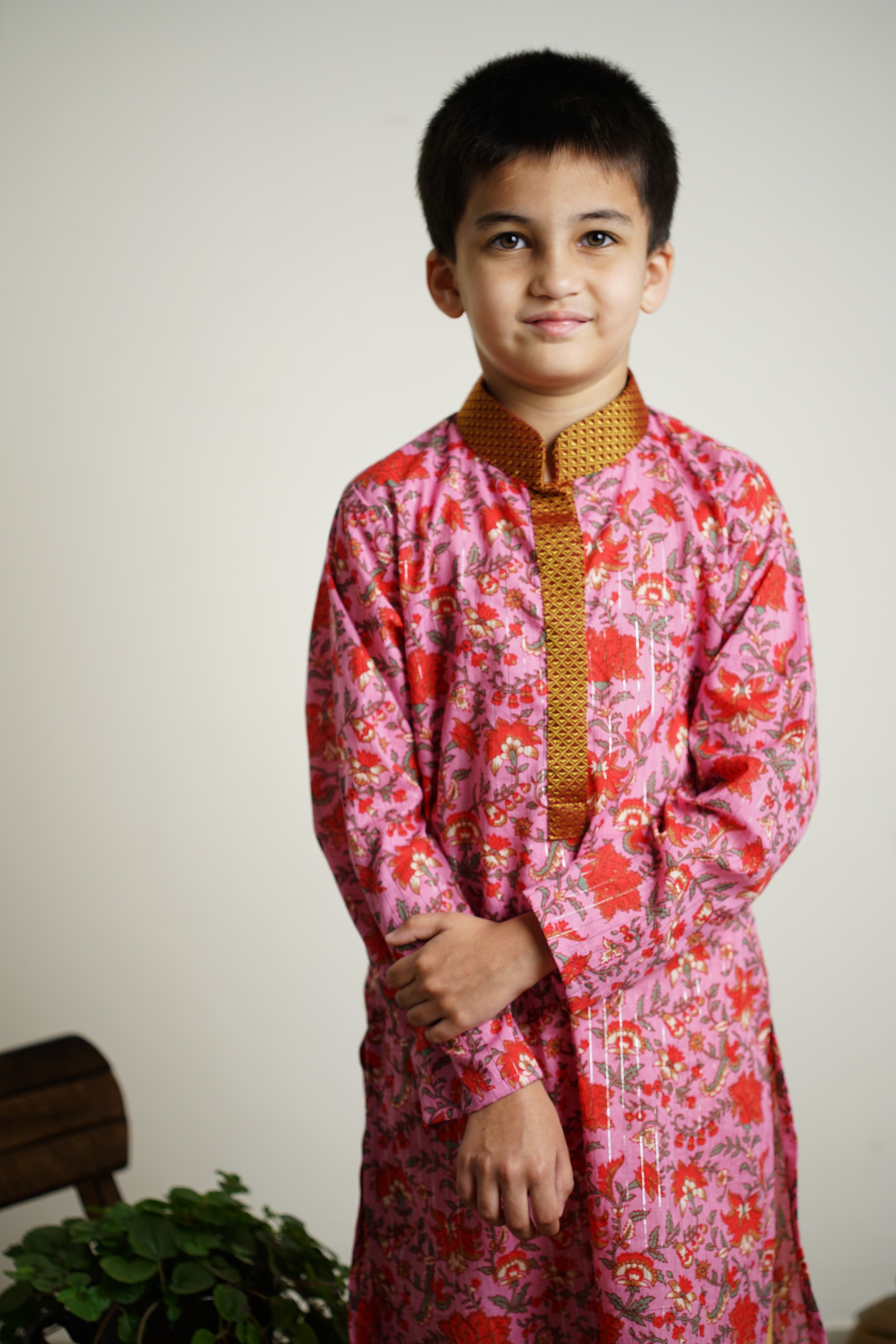 Lilac colored Sanganeri Cotton block printed Stand Collar Kurta with silver jari weaved lines.Kurtas with collar or Angrakha pattern teamed with salwar are the best choice for any festive occasion for boys.They are Trendy, Easy to wear and comfortable to carry.