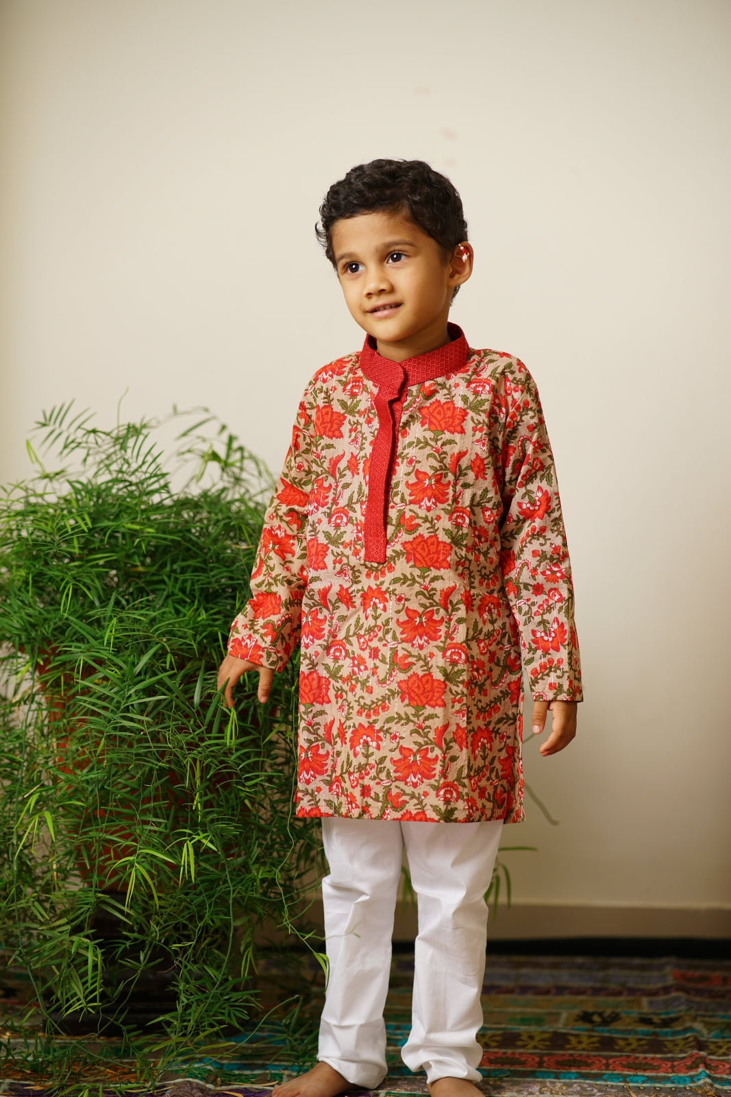 Sanganeri Cotton block printed Stand Collar Kurta with silver jari weaved lines.Kurtas with collar or Angrakha pattern teamed with salwar are the best choice for any festive occasion for boys.They are Trendy, Easy to wear and comfortable to carry.