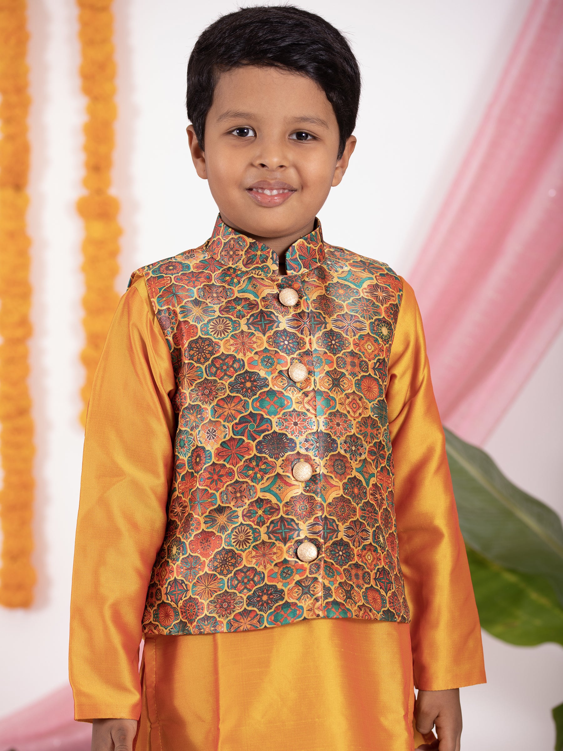 Mango coloured taffeta kurta and salwar set with digital printed silk jacket.Kurtas with collar or Angrakha pattern teamed with salwar are the best choice for any festive occasion for boys. They are Trendy, Easy to wear and comfortable to carry.