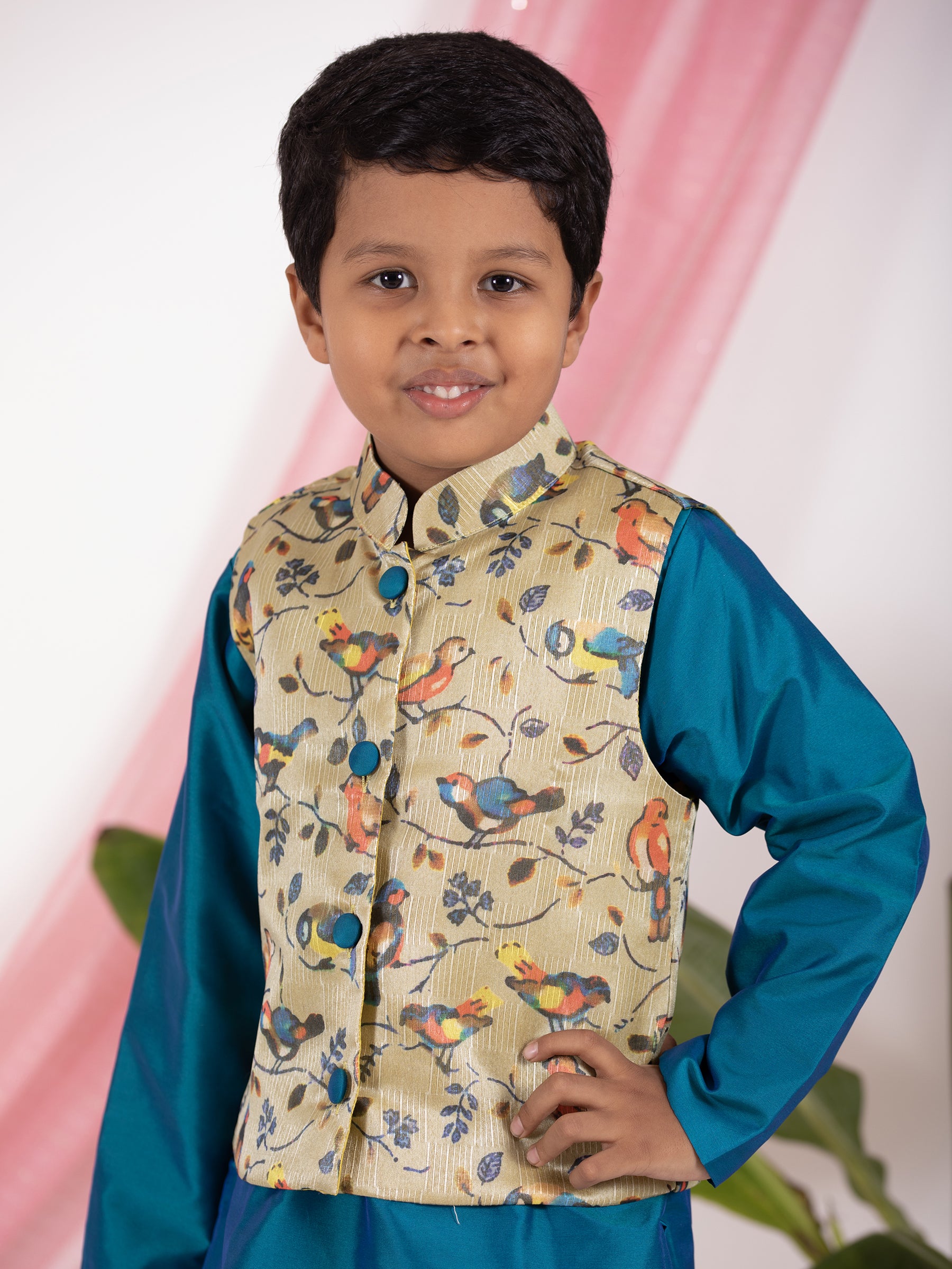 Peacock blue taffeta silk kurta and salwar set with digital printed tussar silk jacket.Kurtas with collar or Angrakha pattern teamed with salwar are the best choice for any festive occasion for boys. They are Trendy, Easy to wear and comfortable to carry.