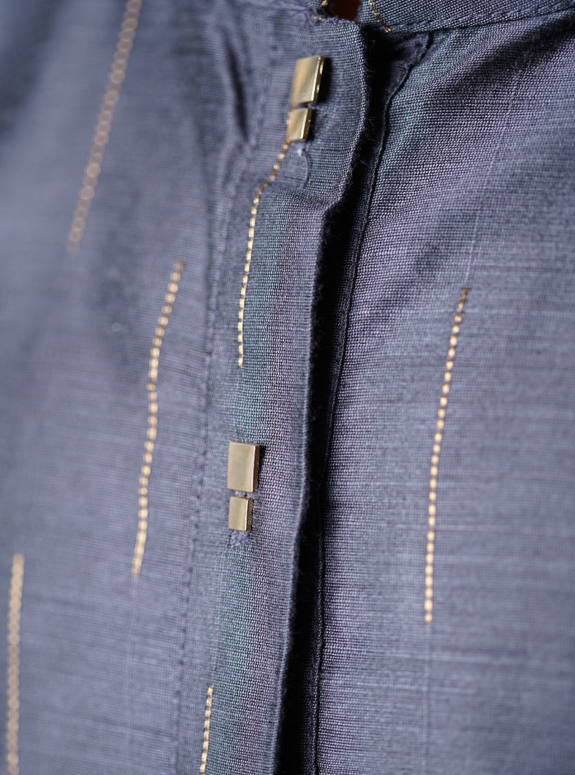 Slate grey pine silk Kurta with interesting jari stripes.Kurtas with collar or Angrakha pattern teamed with salwar are the best choice for any festive occasion for boys.They are Trendy, Easy to wear and comfortable to carry.