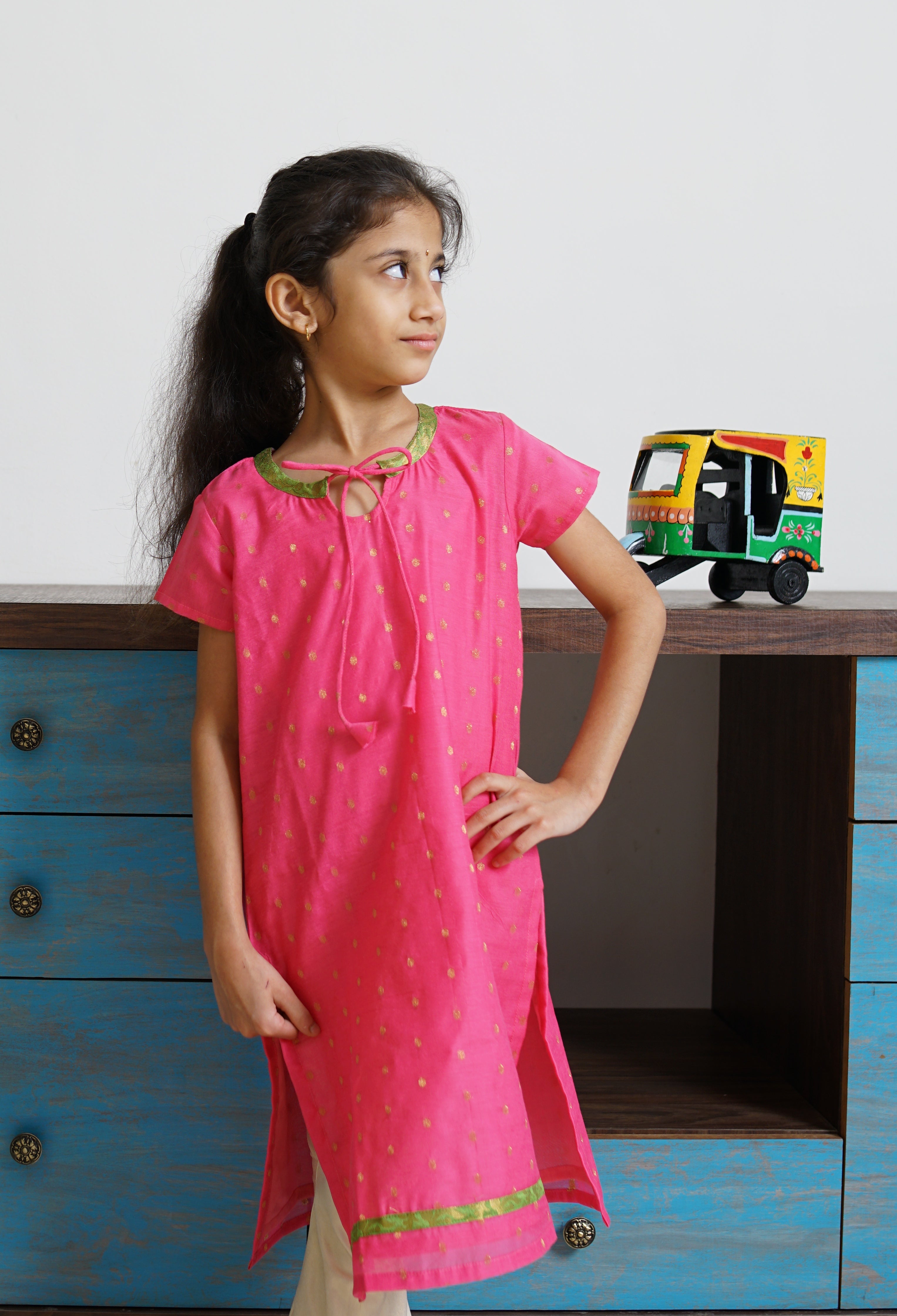 Pink Chanderi kurti with neck pattern.Let your princess be as comfortable as in her casuals with carefully designed & crafted Comfort Ethnic Wear by Soyara Ethnics.Keep her fashion quotient high with timeless patterns, vibrant combinations and royal textiles.