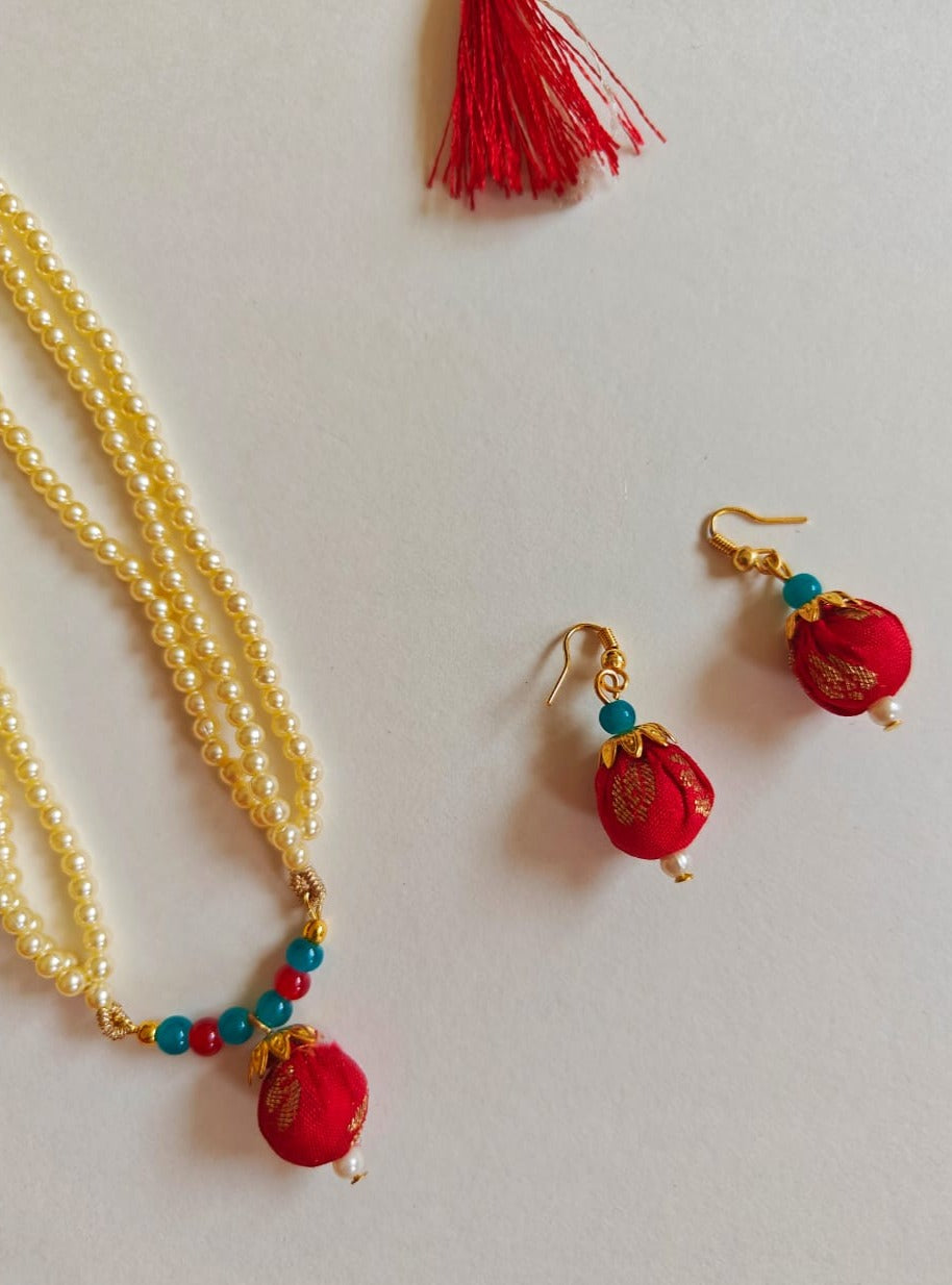 Red brocade fabric pendant and triple layered pearls necklace in combination with red and teal blue glass beads for Girls