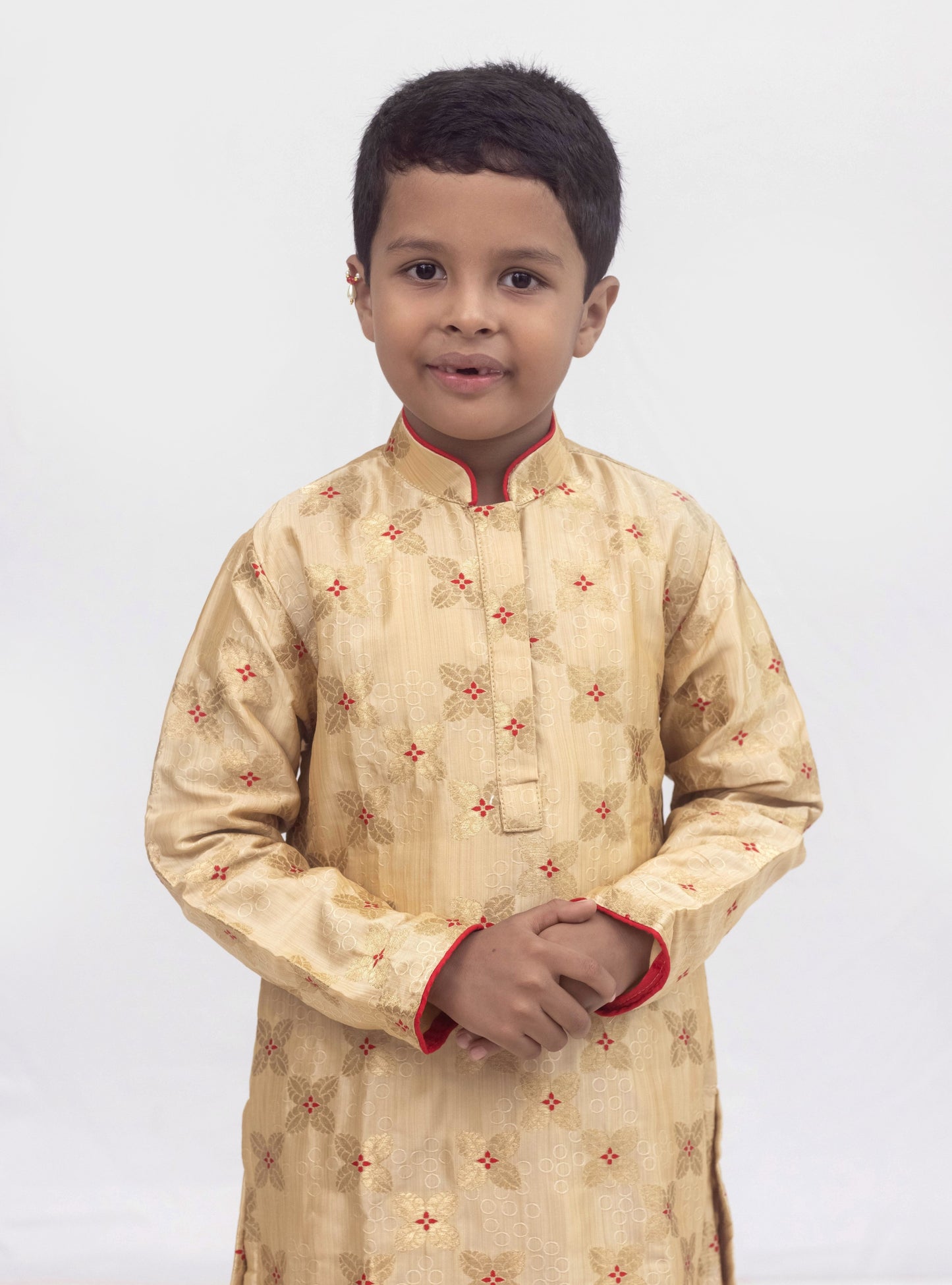 Beige banarasi brocade kurta set with a highlighted stand collar and front placket and red cotton silk chunidar salwar for Boys.Kurtas with collar or Angrakha pattern teamed with salwar are the best choice for any festive occasion for boys. They are Trendy, Easy to wear and comfortable to carry.