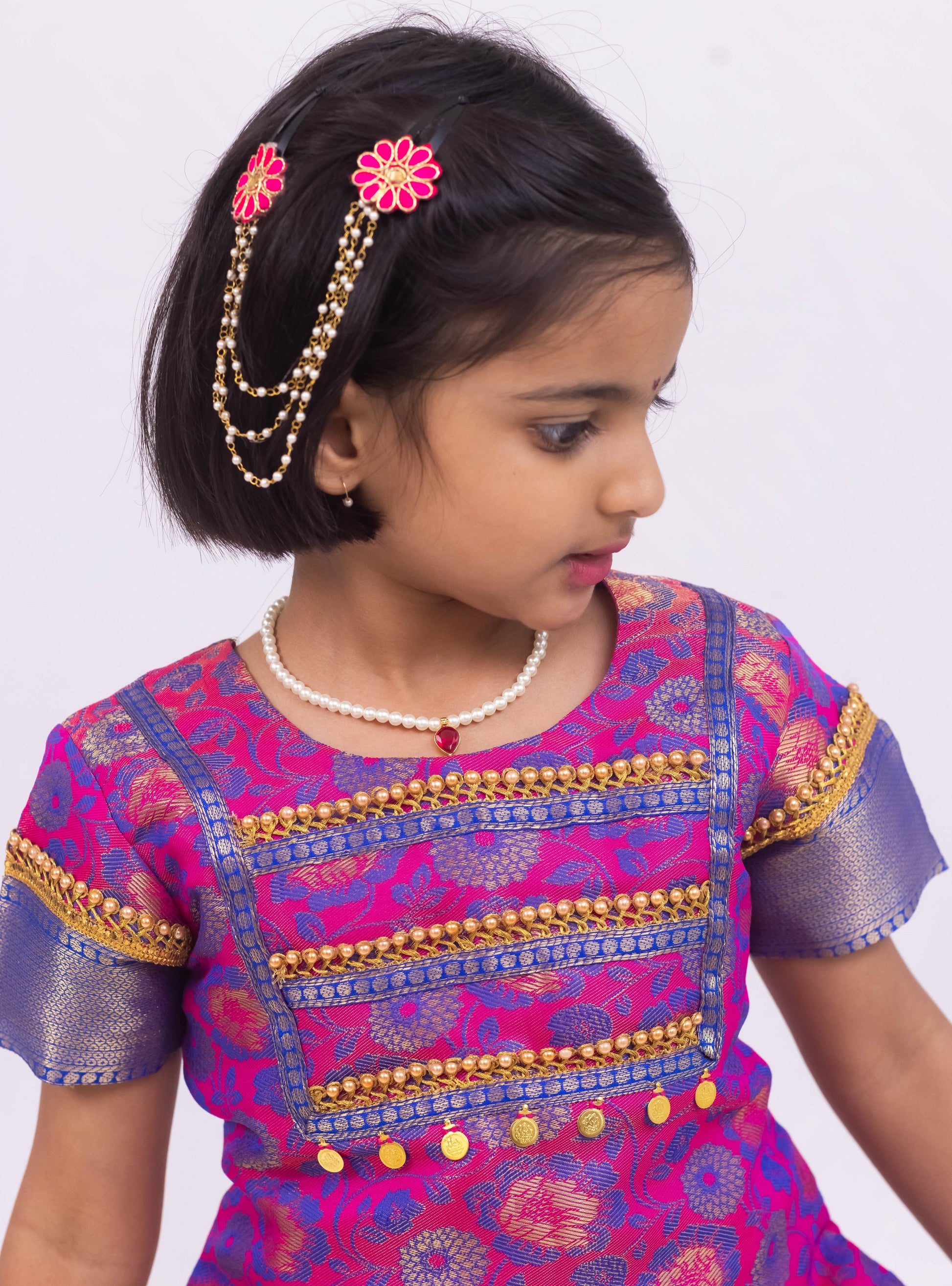 Pink- Dark Blue jacquard brocade Pattu Pavada Parkar Polka set with a heavy yoke pattern for Girls.Let your princess be as comfortable as in her casuals with carefully designed & crafted Comfort Ethnic Wear by Soyara Ethnics.Keep her fashion quotient high with timeless patterns, vibrant combinations and royal textiles.