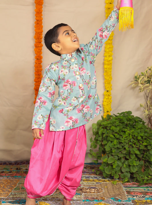 Grey floral printed kurta with pink cotton silk dhoti.Kurtas with collar or Angrakha pattern teamed with salwar are the best choice for any festive occasion for boys. They are Trendy, Easy to wear and comfortable to carry.