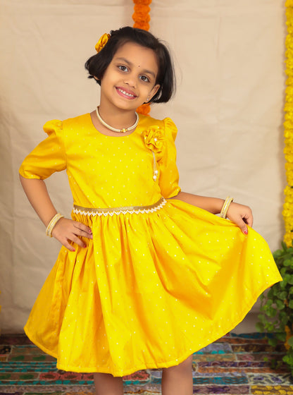 Yellow taffeta dress with elbow length puff sleeves.