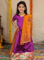 Purple Taffeta Silk Ghagra Choli with a broad statement Paithani Border for girl.Let your princess be as comfortable as in her casuals with carefully designed & crafted Comfort Ethnic Wear by Soyara Ethnics.Keep her fashion quotient high with timeless patterns, vibrant combinations and royal textiles.