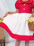 Fuschia brocade silk and Ivory Mysore silk dress with Peter pan collar and puffed sleeves for Girl.Let your princess be as comfortable as in her casuals with carefully designed & crafted Comfort Ethnic Wear by Soyara Ethnics. Keep her fashion quotient high with timeless patterns, vibrant combinations and royal textiles.