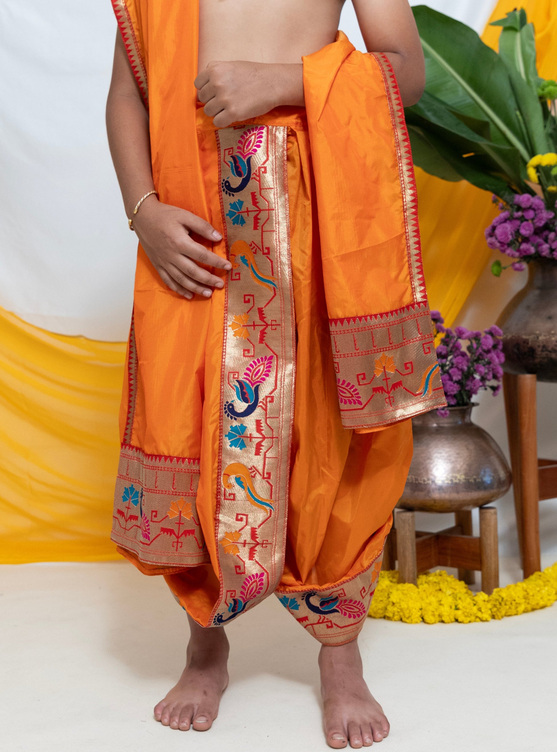Saffron Mysore Silk Dhoti/Soval/Kad & Shawl/Upran/Shela with Paithani jari Border Set for Batu.Pre-stitched sovale uparane set includes Ready to wear Sovale & Uparane/Upavastra.Can be paired with a short kurta.This Set is ideal for rituals like Matrubhojan,Muhurt during Munj/Upanayan/Vratabandha/Thread Ceremony.