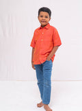 Coral orange Plain Raw silk half sleeved shirt for Boys.This Coral orange Plain Raw silk half sleeved shirt is designed for boys, providing both comfort and style.