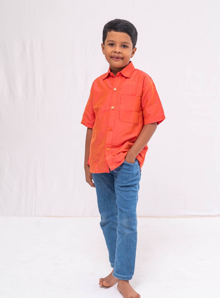 Coral orange Plain Raw silk half sleeved shirt for Boys.This Coral orange Plain Raw silk half sleeved shirt is designed for boys, providing both comfort and style.