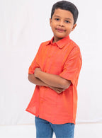 Coral orange Plain Raw silk half sleeved shirt for Boys.This Coral orange Plain Raw silk half sleeved shirt is designed for boys, providing both comfort and style.