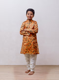 Amber coloured floral printed tussar silk kurta with stand collar for Boys