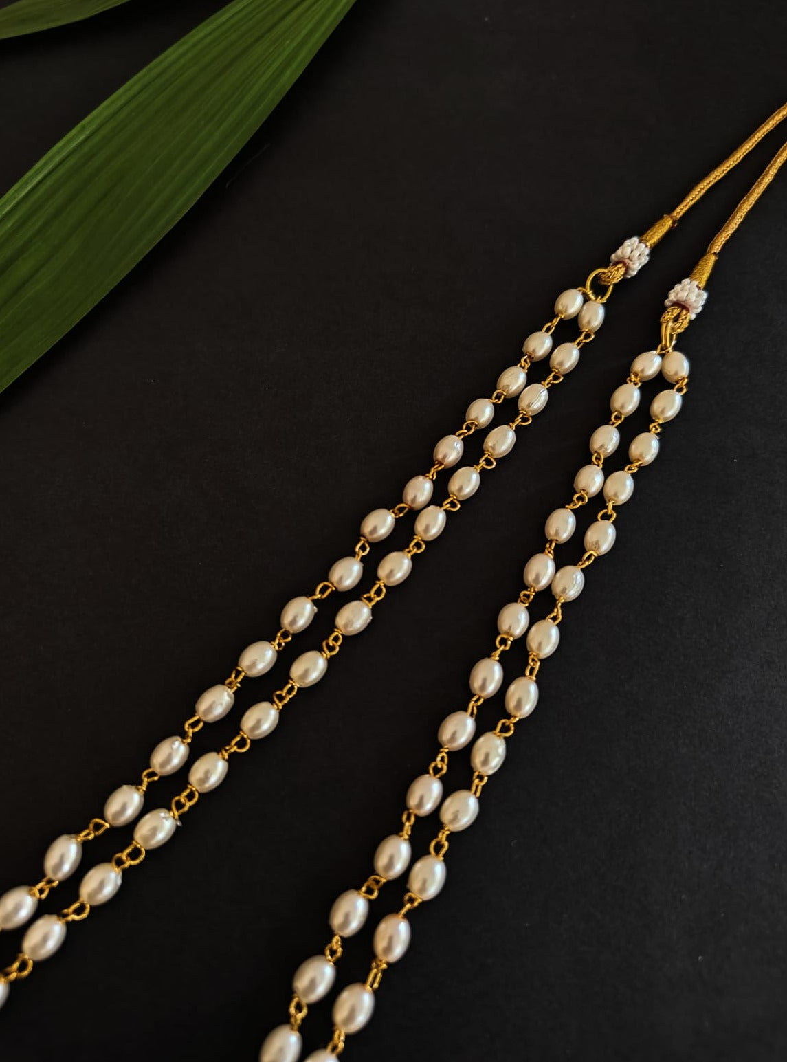 Double Layered Plain oval shaped pearls kanthi for Batu.It is worn by Batu for Vratabandh/Munj/Upnayan/ Thread Ceremony.Mundavalya,kanthi,bhikbali,topi,pagdi are boys accessories exclusively designed using Pearls,glass beads,jadau & gold plated findings for Batu,for Upanayan/Vratabandha/munj /thread ceremony.