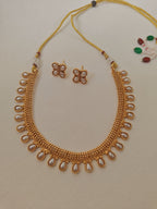 Pearls studded choker with matching earrings for Girls.This set includes a choker and matching earrings with studded pearls, perfect for girls. The drawstring allows for easy length adjustment.