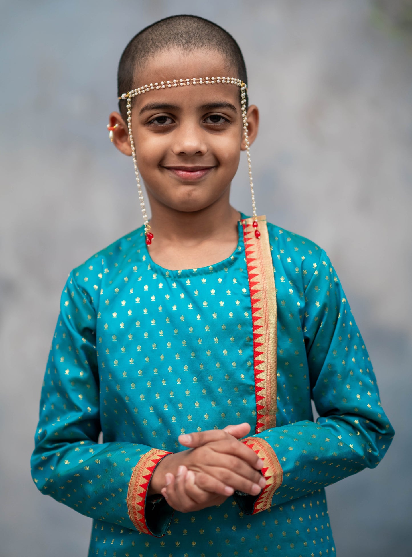 Peacock green brocade silk side placket round neck short kurta with temple border highlights on placket and cuffs for Batu.Kurta is 
ideal for rituals like Matrubhojan,Muhurt during Munj/Upanayan/Vratabandha/Thread Ceremony.