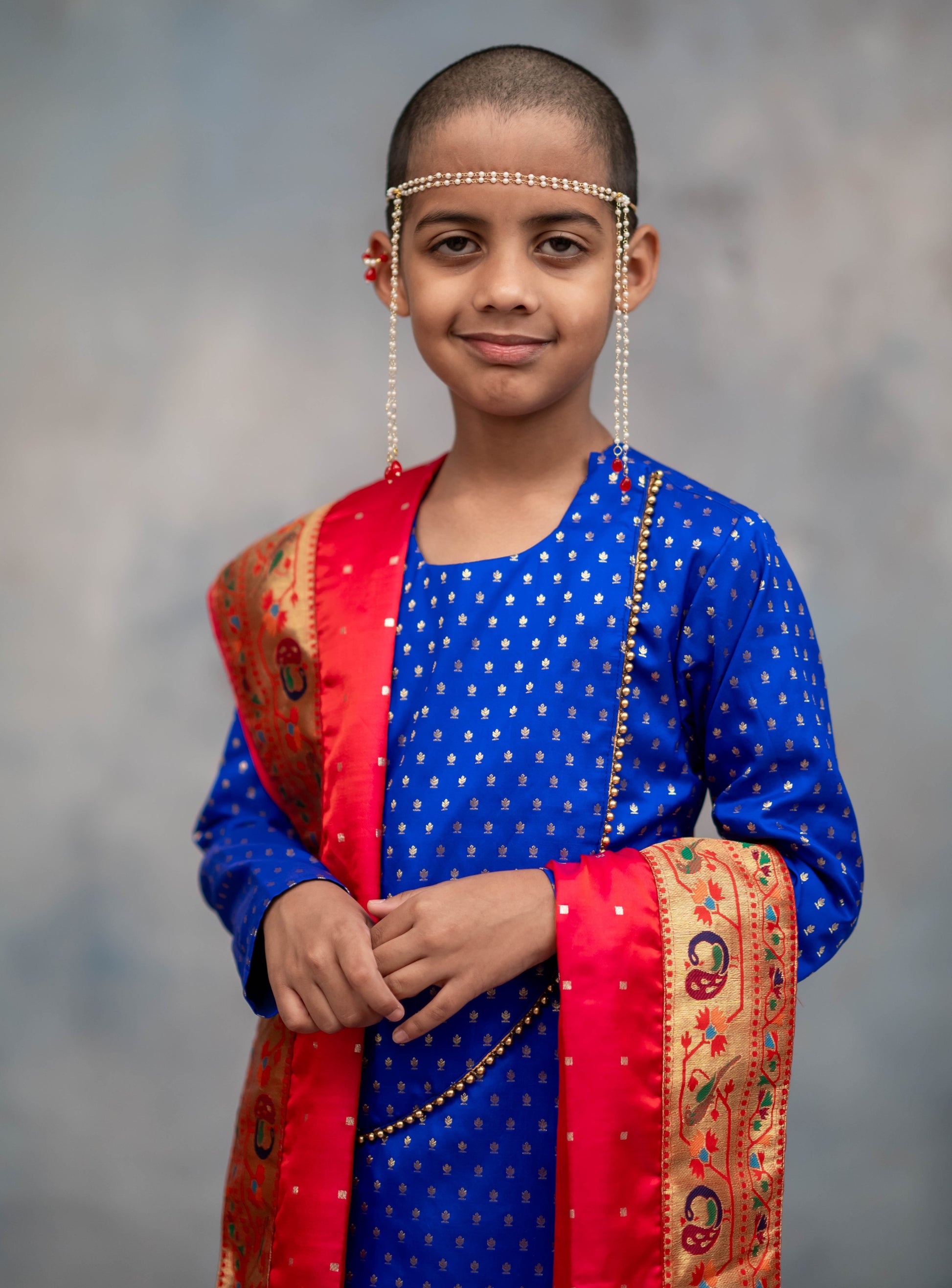 Royal blue brocade silk kurta with rounded overlap pattern embellished with golden beads for Batu.Pre-stitched sovale uparane set includes Ready to wear Sovale & Uparane/Upavastra.Can be paired with a short kurta.This Set is ideal for rituals like Matrubhojan,Muhurt during Munj/Upanayan/Vratabandha/Thread Ceremony.