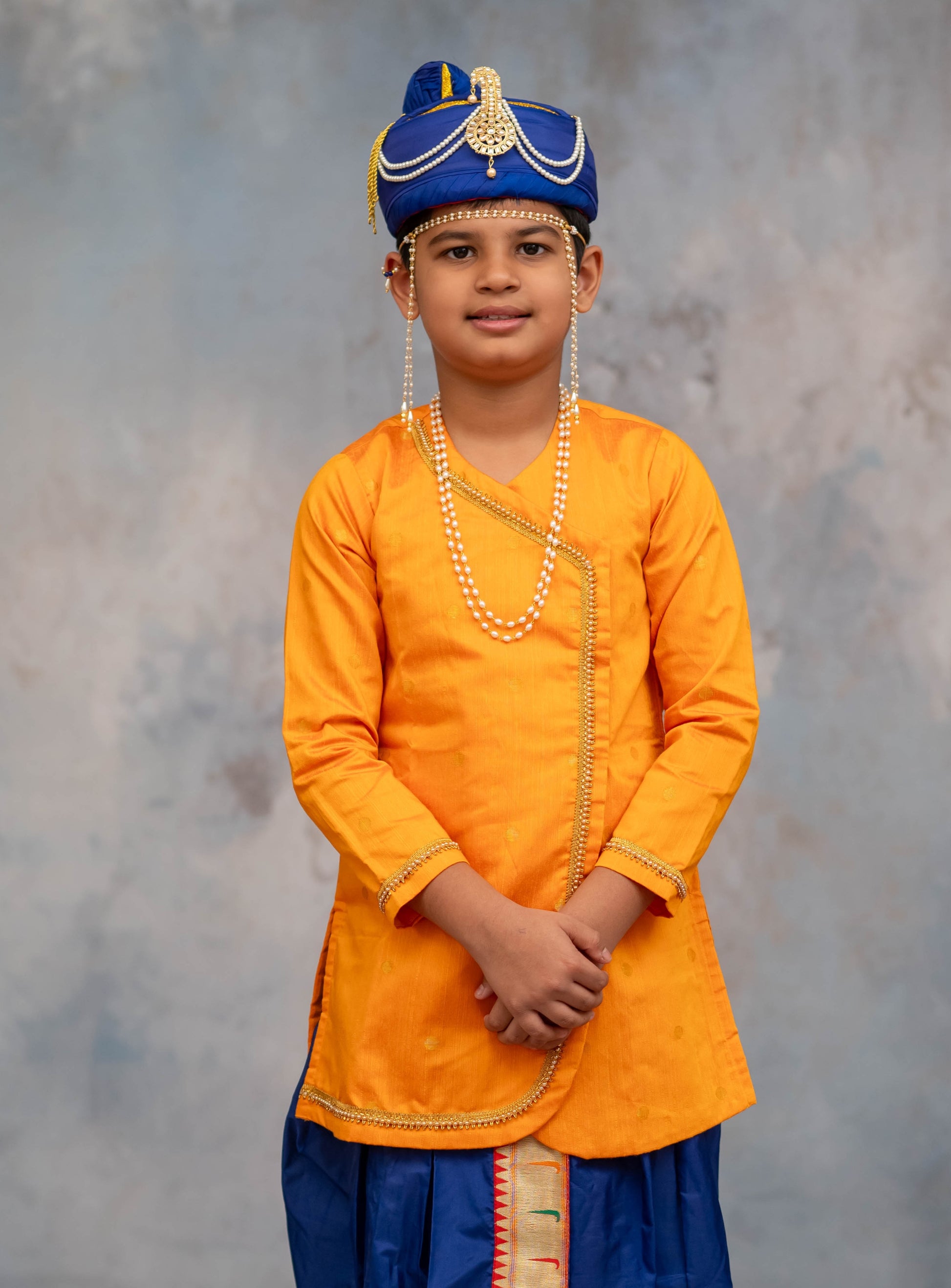 Mango coloured cotton silk big jari butta front open short kurta with pearls embellished lace highlights defining the curve and around cuffs for Batu.Kurta is ideal for rituals like Matrubhojan,Muhurt during Munj/Upanayan/Vratabandha/Thread Ceremony.