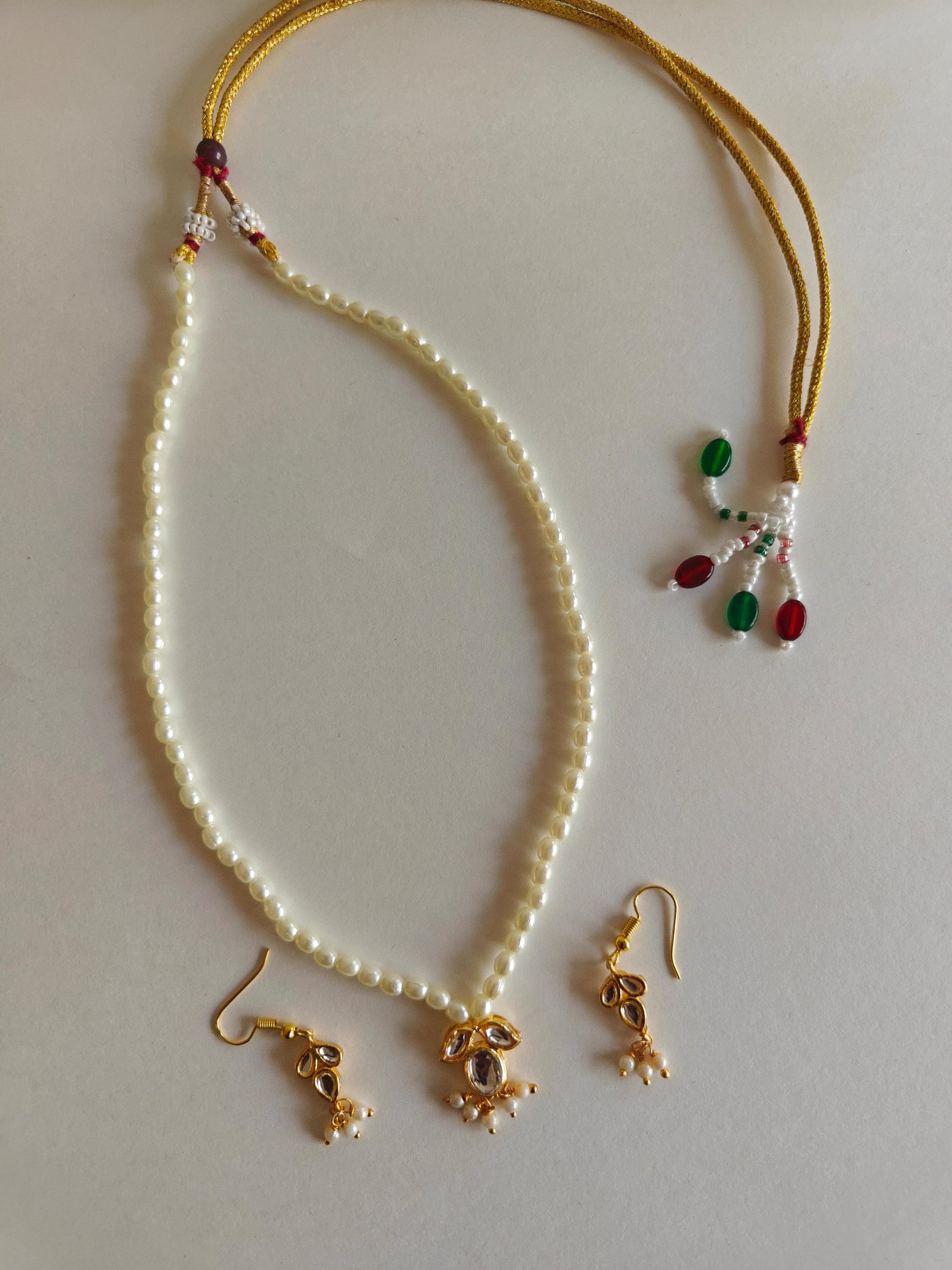 Mukta Set - Pearl chain necklace with Kundan pendant stringed pearls necklace with leaf shaped kundan studded pendant and matching earrings for Girls.