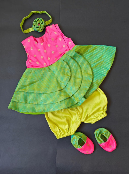 Pink soft brocade & green front open layered dress with bloomer,headband,booties for a newborn baby girl.It's the perfect outfit for your baby's naming ceremony,naamkaran or annaprashan ceremony.Traditional dress for Noolukettu Ceremony,Pachavi Puja,cradle ceremony,Rice Ceremony,Chatti Puja etc. Apt gifting idea