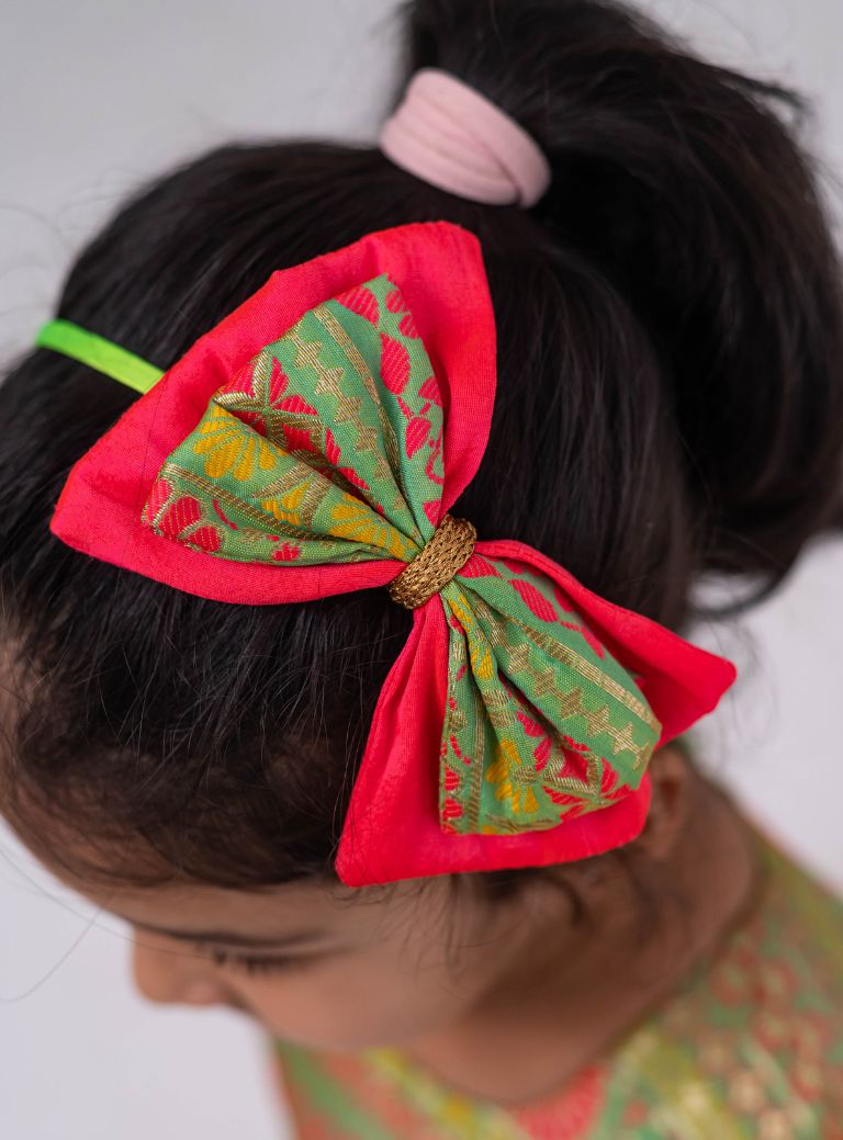 Neon green banaras brocade with candy pink raw silk flared cap sleeved dress for Girls. Elevate any occasion with this unique piece.Let your princess be as comfortable as in her casuals with carefully designed and crafted Comfort Ethnic Wear by Soyara Ethnics. 