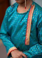 Peacock green brocade silk side placket round neck short kurta with temple border highlights on placket and cuffs for Batu.Kurta is 
ideal for rituals like Matrubhojan,Muhurt during Munj/Upanayan/Vratabandha/Thread Ceremony.