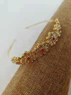 Kundan studded flower and leaves motifs mathapatti headband in golden metal for Girls.Adorn your princess with head to toe premium quality handcrafted accessories made from allergy free, best quality materials.