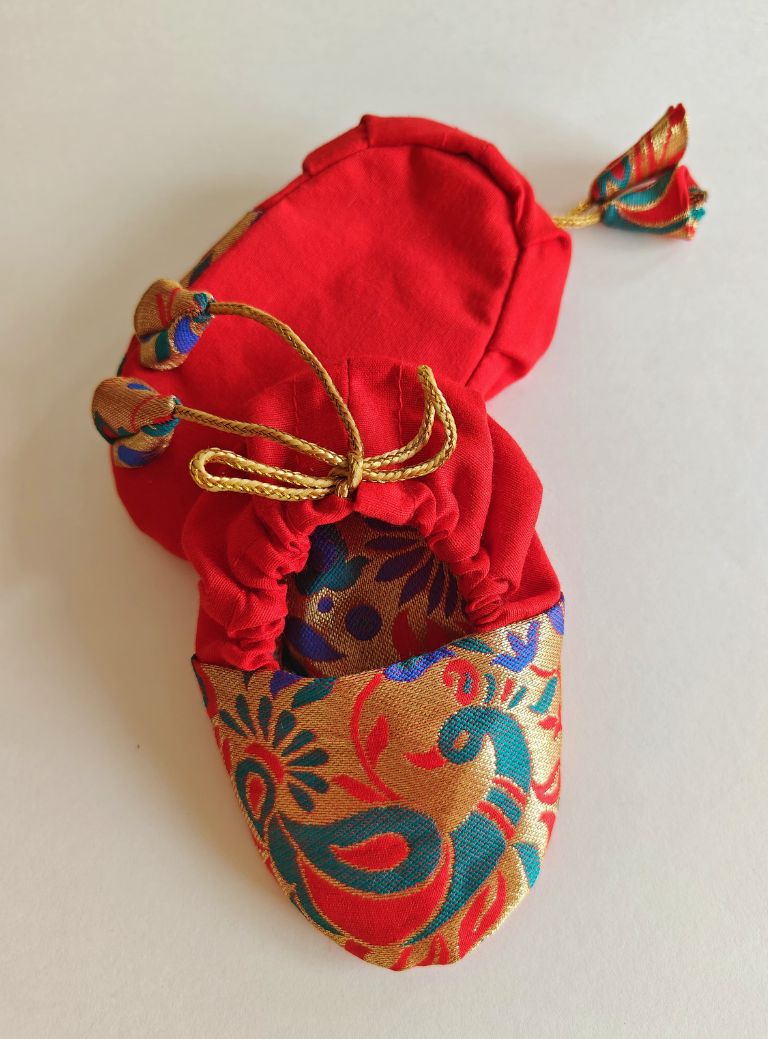 red Peacock Paithani Motif, adjustable unisex Newborn Baby Mojaris /Booties.Paithani motif unisex booties for baby. Team these with any ethnic dress and complete the royal look! Completely made out of fabrics inside out , make these booties perfectly comfy first ethnic wear for the newborn.