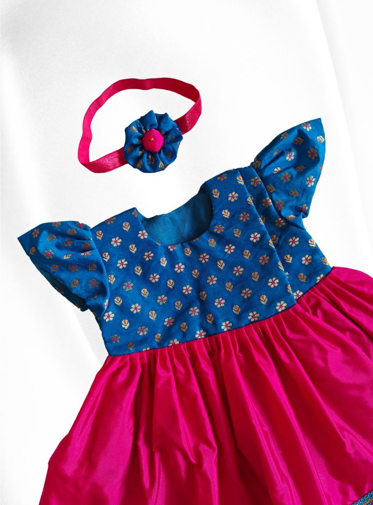 Blue brocade with rani pink malai silk front open flared newborn baby girl frock for naming ceremony with bonnet,bloomer & booties.It's the perfect outfit for your naamkaran or annaprashan ceremony.Traditional dress for Noolukettu Ceremony,Pachavi Puja,cradle ceremony,Rice Ceremony,Chatti Puja etc.Apt gifting idea