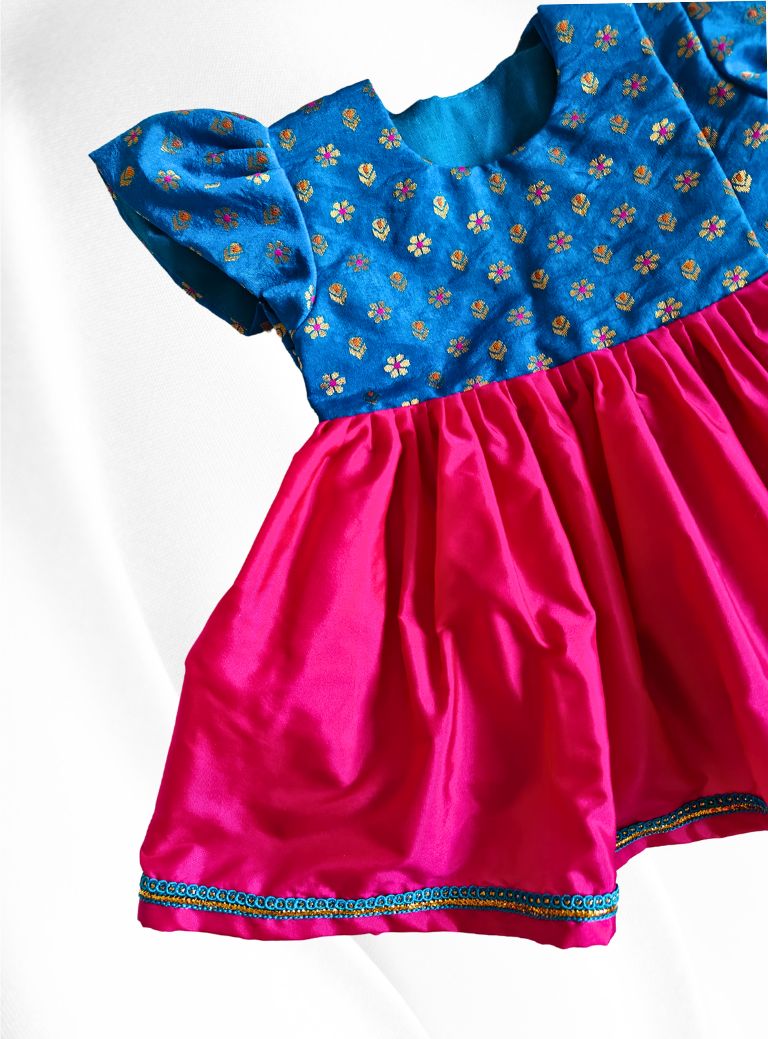 Blue brocade with rani pink malai silk front open flared newborn baby girl frock for naming ceremony with bonnet,bloomer & booties.It's the perfect outfit for your naamkaran or annaprashan ceremony.Traditional dress for Noolukettu Ceremony,Pachavi Puja,cradle ceremony,Rice Ceremony,Chatti Puja etc.Apt gifting idea