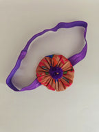 Purple paithani fabric flower elasticated headband for baby girl.