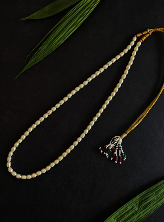 Oblong Pearl Single Layer Kanthi for Batu.It is worn by Batu for Vratabandh/Munj/Upnayan/ Thread Ceremony. Mundavalya,kanthi,bhikbali,topi,pagdi are boys accessories exclusively designed using Pearls,glass beads,jadau & gold plated findings for Batu,for Upanayan/Vratabandha/munj /thread ceremony.