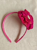 This Dark pink Big Handcrafted fabric flower headband with pearls embellishment for Girls is expertly crafted with immense love and suitable for girls above the age of 2 years. The intricate handwork and delicate pearl detailing make it a standout accessory for any young girl.