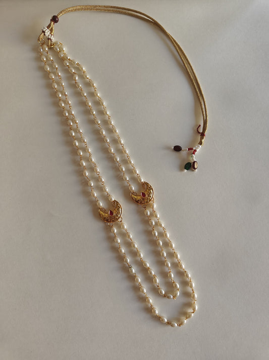 Statement Big Chandrakor Kanthi for Batu.
Round shaped pearls chain neckpiece for boys with unique moon crescent findings give final touch to the Royal Look!