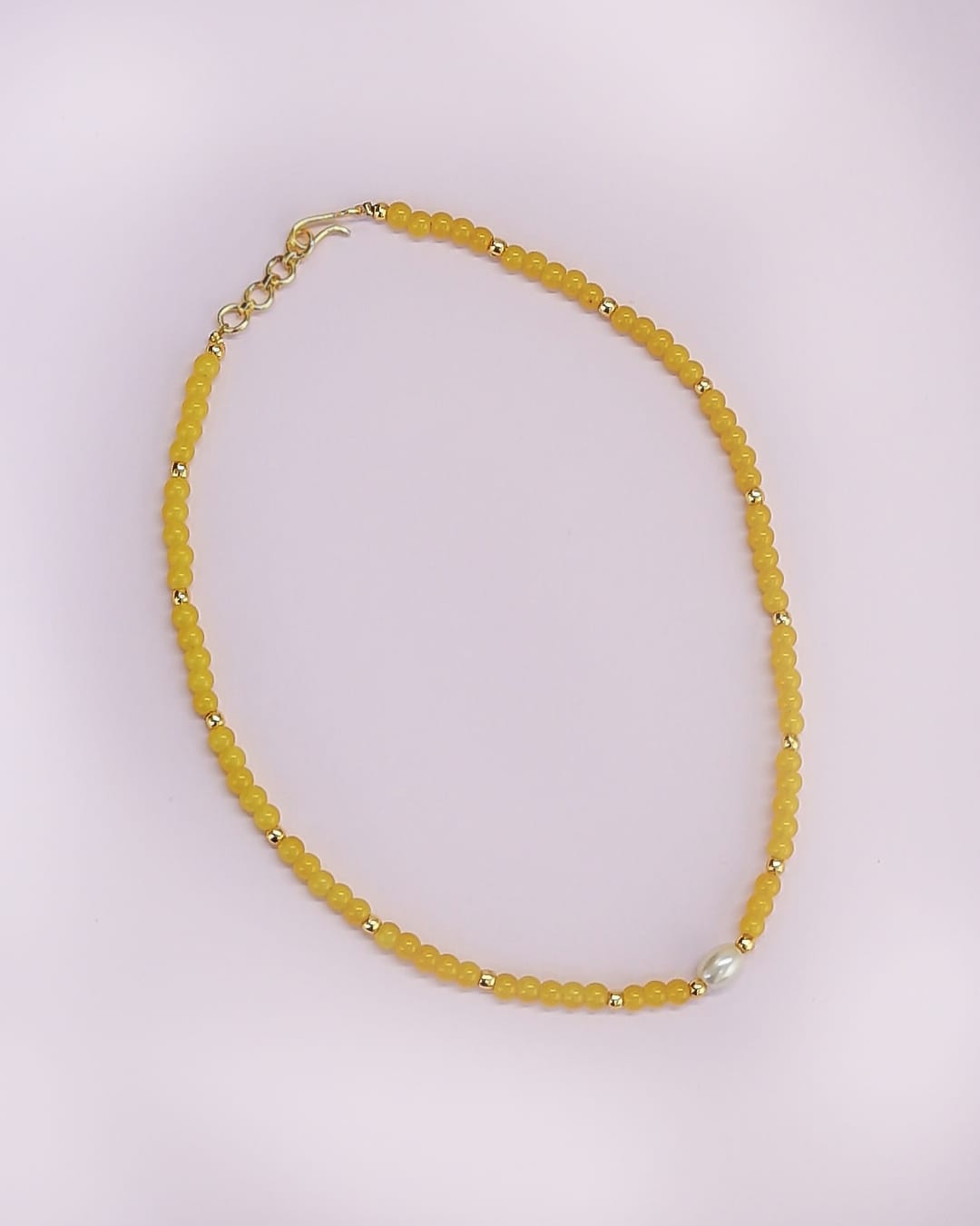 Turmeric Yellow glass beads necklace with gold plated findings and an oval pearl pendant for Girls