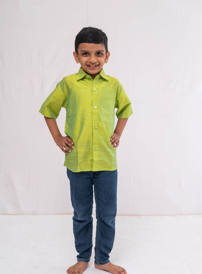 Parrot Green Plain Raw silk half sleeved shirt for Boys.This Parrot Green Plain Raw silk half sleeved shirt is designed for boys, providing both comfort and style.