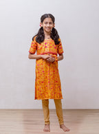 Yellow soft silk banaras brocade kurti with yoke pattern embellished with contrast pompom lace for Girls