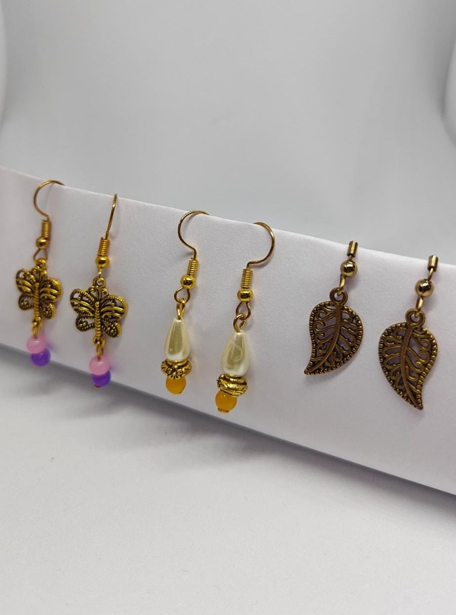 Accessories gifts fancy traditional ethnic trendy handmade accessories handcrafted matching assorted mix n match pearl multicolour metal golden nath nose pin nathani Marathi gold plated Maharashtrian accessory zumka jhumka moti vel single layer double layer dangling 