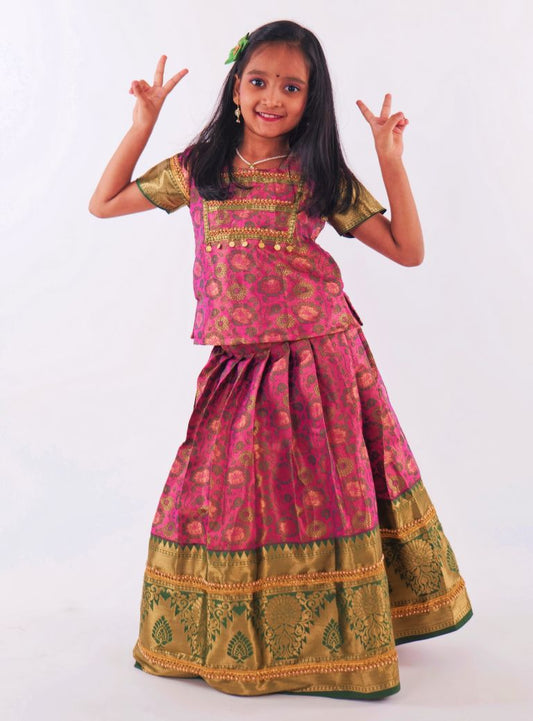 Pink and Dark Green woven banarasi jacquard brocade Pattu Pavada Parkar Polka set with a heavy yoke pattern for Girls.Let your princess be as comfortable as in her casuals with carefully designed & crafted Comfort Ethnic Wear by Soyara Ethnics.Keep her fashion quotient high with timeless patterns, vibrant combinations and royal textiles.